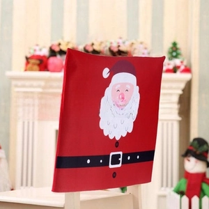 Close-up of red Christmas chair cover with Santa Claus motif and decorative belt detail