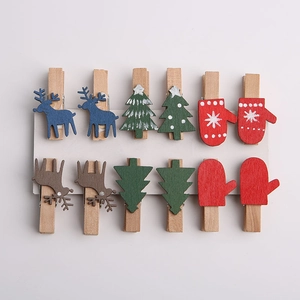 Set of 12 Christmas wooden clips featuring reindeer, trees and red gloves on white card