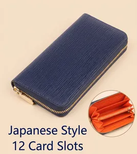 Detail of blue Epi leather long wallet with 12 card slots and orange interior lining