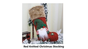 Close-up of a red knitted Christmas stocking with gnome applique and wooden button detail