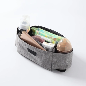 Gray stroller organizer bag with bottle pockets and velcro straps on white background