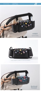 Detail of stroller organizer showing dual bottle pockets and space-themed animal patterns