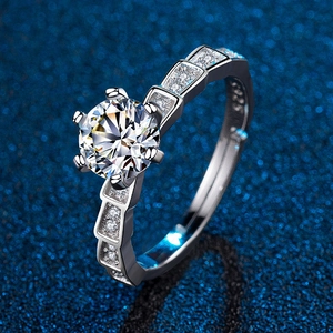 Detail of S925 silver ring with six-prong set solitaire stone and side pavé accents