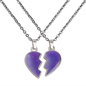 Detail of interlocking purple glitter heart pendants on stainless steel chains for couples