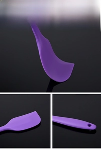 Detail of purple seamless silicone spatula showing flexible head and handle hanging hole