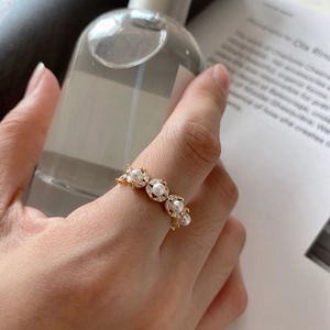 Elegant 925 sterling silver gold ring with four pearls and marquise rhinestones on hand