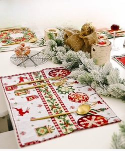 Close-up of festive Christmas knit placemat with reindeer and snowflake patterns