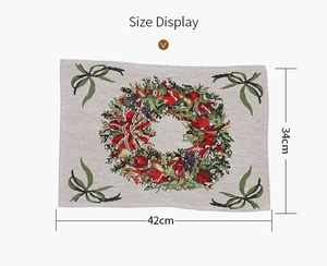 Size display of a rectangular knitted Christmas placemat with festive wreath pattern