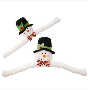 Detail of Christmas snowman curtain buckles with black top hats and red striped bowties