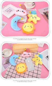 Detail view of plush cartoon star moon sun and cloud charms with small metal clips
