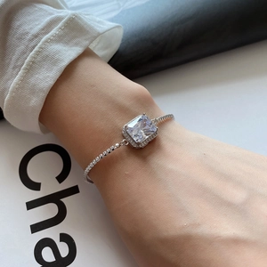 Minimalist 925 sterling silver bracelet with a large rectangular zircon stone on wrist