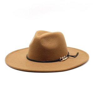 Detailed shot of brown wool fedora hat featuring black string and gold chain accent