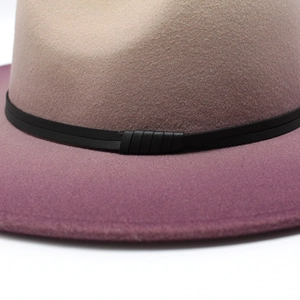 Detailed close-up of gradient wool jazz hat with purple fade and black leather band