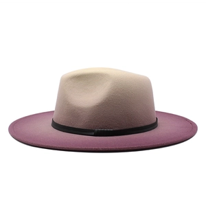 Detail of wool fedora showing smooth beige to purple gradient and thin black leather band