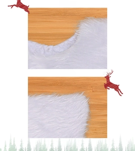 Detail of white faux fur Christmas tree skirt showing fluffy texture and plush material