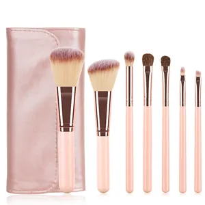 Detail of 7-piece mini makeup brush set with pink leather pouch and rose gold handles