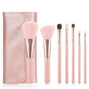 Detail view of 7-piece pink makeup brush set with rose gold ferrules and travel pouch