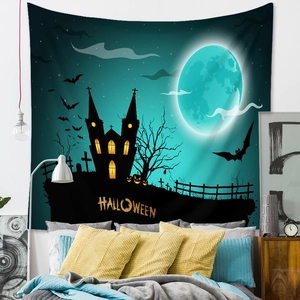 Detail of Halloween tapestry showing moon, castle, and pumpkins on polyester fabric