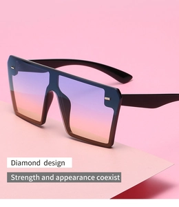 Close-up of frameless square sunglasses with purple-orange gradient lenses and black frames