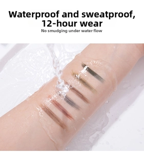 Macro shot showing 6 eyebrow pencil swatches on skin under running water to prove waterproof effect