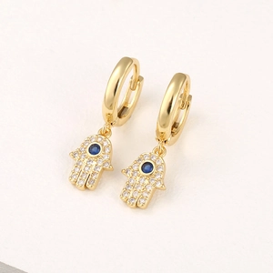 Hamsa Hand drop earrings in gold with blue zircon evil eye and pave crystals