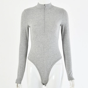 Detail of grey long sleeve bodysuit with half-zipper front and high cut on a mannequin