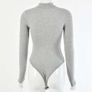 Detail view of grey long sleeve bodysuit showing high cut back and cotton texture