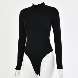 Detailed close-up of a black long-sleeve bodysuit with high neck zipper on a white mannequin