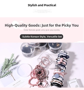 Hair tie set including pearl accents and fabric bows in clear cylindrical storage jars
