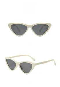 Detailed front and side view of chic beige cat eye sunglasses with grey lenses