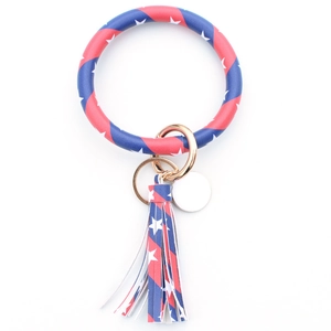 Macro detail of PU leather keychain bracelet with American flag pattern and golden ring