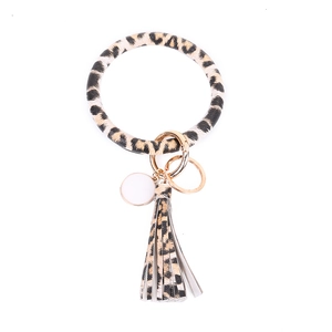 Detail of leopard print PU leather wristlet keychain with tassel and gold metal ring