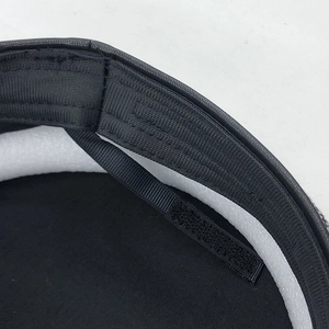 Detail of adjustable velcro strap and fabric texture inside the black wool octagonal hat