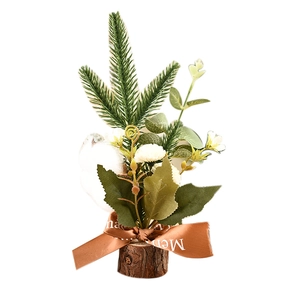 Mini Christmas tree ornament with pine needles, cotton and wood base on white background