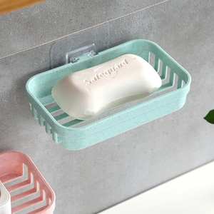 Wall-mounted green wheat straw soap dish with drainage slots for bathroom use
