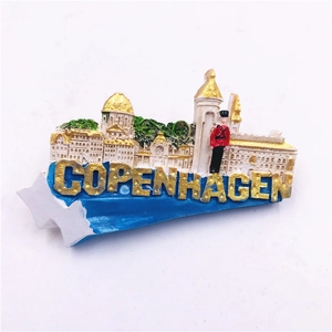 Macro detail of a colorful resin Copenhagen 3D relief fridge magnet with gold lettering