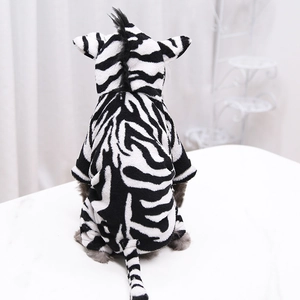 Detail of warm zebra pattern pet hoodie showing soft flannel texture and tail design
