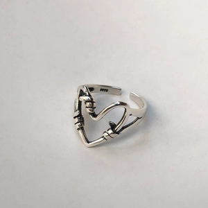 Minimalist 925 sterling silver open ring featuring an intricate knotted heart design