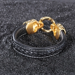Braided leather bracelet with golden double leopard heads and stainless steel clasp