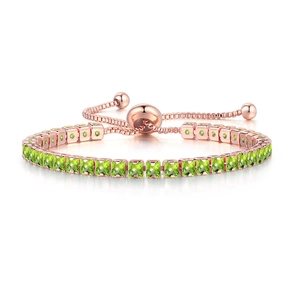 Detail of rose gold bolo bracelet featuring square-cut green zircons and adjustable slider