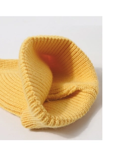 Detailed close-up of yellow ribbed knit texture and soft lining for a warm baby winter hat