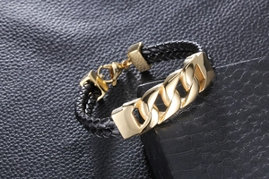 Detail of gold-plated stainless steel chain and black braided leather strap for men