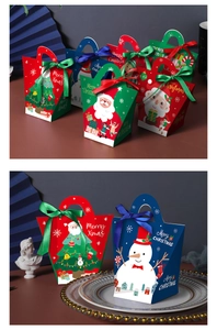 Detail of Christmas candy gift boxes with festive ribbons, Santa and snowman patterns