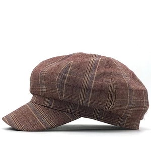 Classic red plaid newsboy cap with textured wool blend and structured short brim