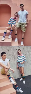 Detail of trendy striped crew socks featuring retro color blocks and street style patterns