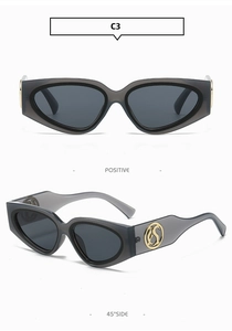 Detailed views of translucent grey cat eye sunglasses with gold logo on wide temples