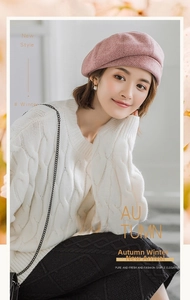 Detail of pink plaid wool beret with warm knit sweater and decorative floral frame