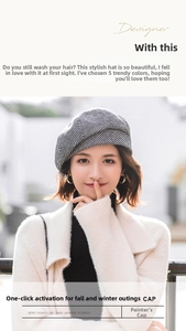 Detail shot of a black and white houndstooth beret hat for women in autumn and winter