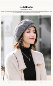 Close-up of classic houndstooth beret hat with textured wool fabric for winter