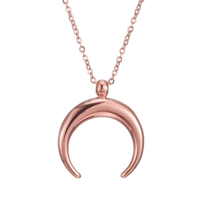 Close-up of polished rose gold crescent moon pendant and matching chain necklace